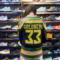 تيشيرت هوكي مطرز يسمح بمرور الهواء مصنوع من البولي...