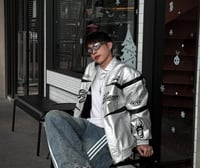 Hellstar's red bomber jacket is decorated with a b...