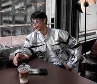 Hellstar's red bomber jacket is decorated with a b...