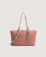 شنطة نسائية بمقاس كبير باللون الوردي