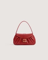 شنطة نسائية بمقاس متوسط بلون عودي