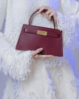 شنطة دفء النسائية جلد بلون عودي