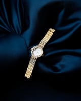 ساعة نسائية بسير من الستيل بلون ذهبي