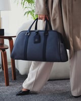 شنطة للجنسين بتصميم عملي بلون أزرق