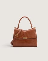 شنطة نسائية متوسطة الحجم بلون بني