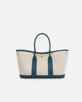 ‎ شنطة نسائية من القماش والجلد بلون أزرق وبيج