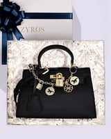 شنطة نسائية من الجلد باللون الأسود