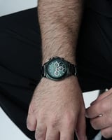 ساعة رجالية ستيل لون أسود بإطار أخضر