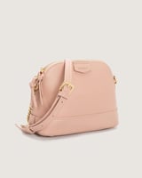 شنطة نسائية بتصميم أنيق بلون وردي