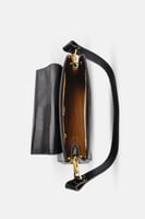 ‎ شنطة نسائية بتصميم عصري بلون أسود