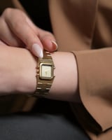 ساعة مدى النسائية بسير من الستيل بلون ذهبي