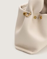 شنطة أمجاد النسائية جلد باللون البيج