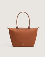 شنطة نسائية بمقاس كبير بلون بني