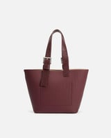 شنطة بتصميم واسع تكفي لأغراضك بلون عودي