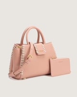 شنطة نسائية متوسطة الحجم بلون وردي