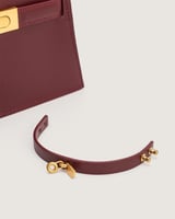 شنطة دفء النسائية جلد بلون عودي