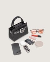 شنطة بريق النسائية جلد بلون أسود