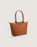 شنطة نسائية بمقاس كبير بلون بني