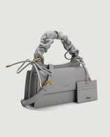 شنطة نسائية بتصميم مميز بلون رمادي