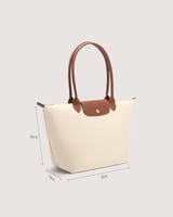 شنطة نسائية بمقاس كبير بلون بيج وبني