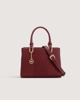 شنطة بلون عودي بحجم متوسط لكل يوم