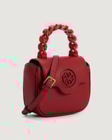 ‎ شنطة نسائية أنيقة بلون أحمر