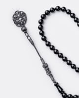 سبحة من حجر البكلايت باللون الأسود