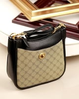 ‎ شنطة نسائية بتصميم أنيق بلون أسود