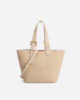 شنطة بتصميم واسع تكفي لأغراضك بلون بيج