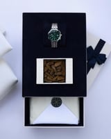 هدية رجالية تحتوي كسر عود وساعة وقماش