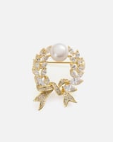 بروش نسائي بتصميم أنيق بلون ذهبي