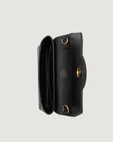 ‎ شنطة نسائية بتصميم عصري بلون أسود.