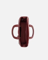 شنطة نسائية بحجم كبير باللون العودي