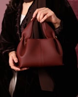 شنطة أمجاد النسائية جلد باللون العودي