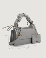 شنطة نسائية بتصميم مميز بلون رمادي