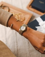 ساعة ألماس نسائية ستيل بلون فضي وذهبي