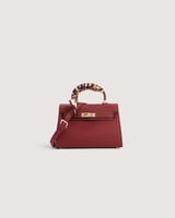 شنطة نسائية بلون عودي بحجم متوسط لكل الأوقات