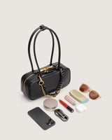 شنطة ترف النسائية باللون الأسود