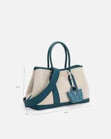 ‎ شنطة نسائية من القماش والجلد بلون أزرق وبيج