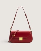 شنطة نسائية باللون العودي