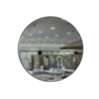 مرآة جدارةي دائرية الشكل