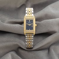 ساعة نسائية باللونين الفضي والذهبي ميناء كحلي