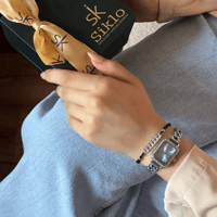 طقم ساعة استيل متفرده وإسواره ساحره باللون الفضي م...