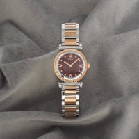 ساعة نسائية باللونين الفضي والنحاسي