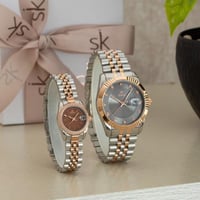 ساعة رجالية ونسائية باللون الفضي والنحاسي