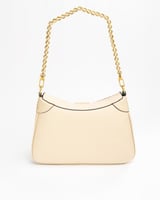 شنطة باللون البيج حجم وسط