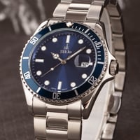 الساعة التي تميزك بحضور أنيق و عصري باللون الفضي م...