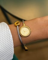 ساعة نسائية حصير باللون الذهبي الفضي ميناء ذهبي..