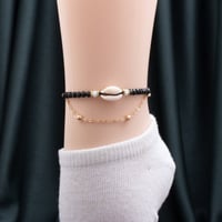 خلخال نسائي باللونين الأسود والذهبي