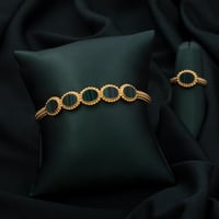 طقم اسوارة وخاتم باللون الذهبي